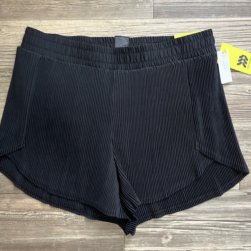 Brand new All in Motion pleated shorts in a size Medium.